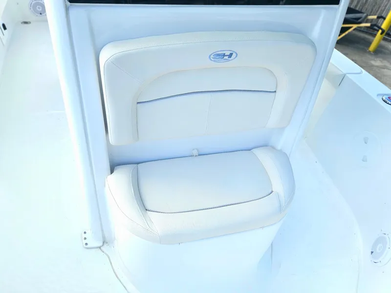 Slide: The Image of 2025 Sea Hunt BX 25 FS boat seat with white cushioned backrest. - 23