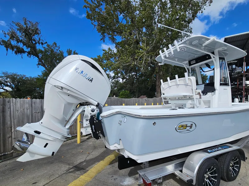 Slide: The Image of 2025 Sea Hunt BX 25 FS boat with Yamaha outboard motor on trailer. - 6