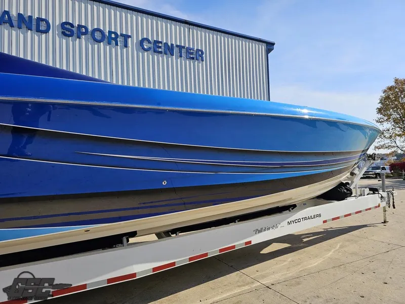 Slide: The Image of 2008 Outerlimits 46 Limited boat on trailer at sport center. - 11