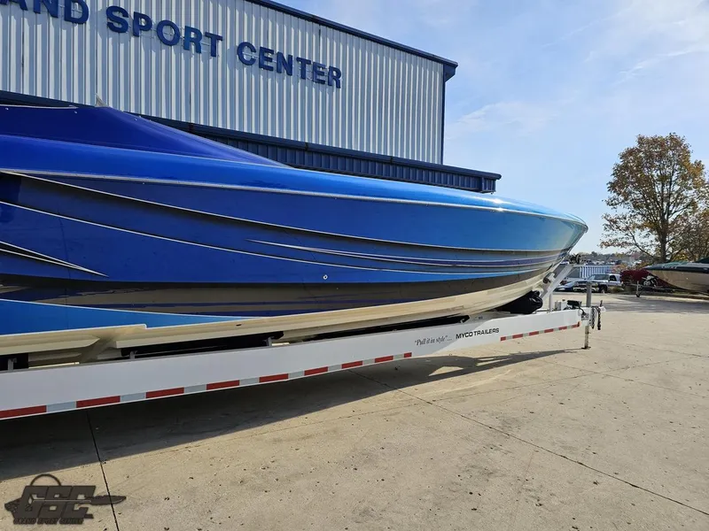 Slide: The Image of 2008 Outerlimits 46 Limited boat on trailer at sport center. - 12
