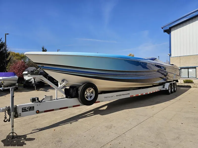 Slide: The Image of 2008 Outerlimits 46 Limited speedboat on trailer, sleek design, vibrant blue accents. - 19
