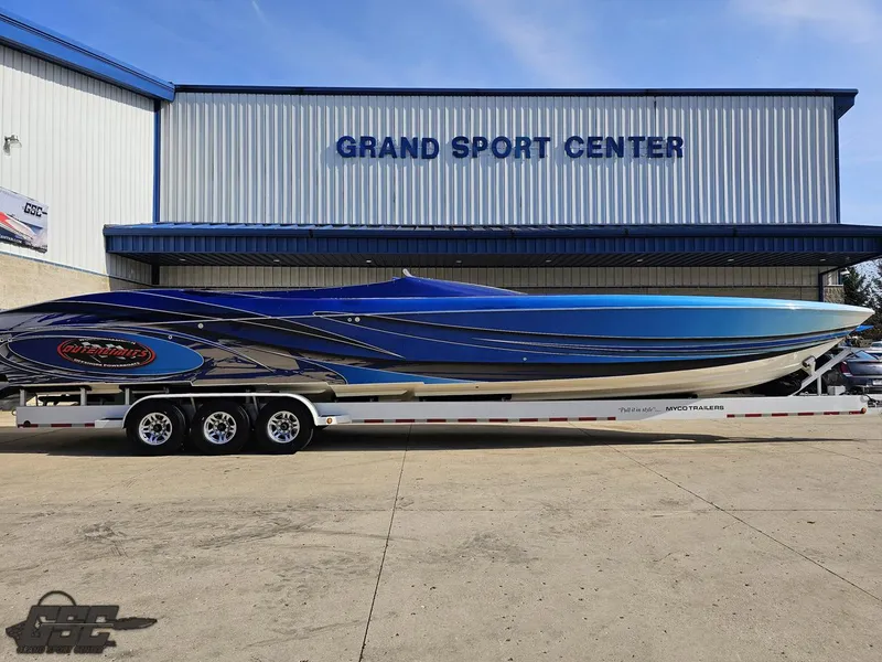 Slide: The Image of 2008 Outerlimits 46 Limited boat at Grand Sport Center, blue and black design. - 3