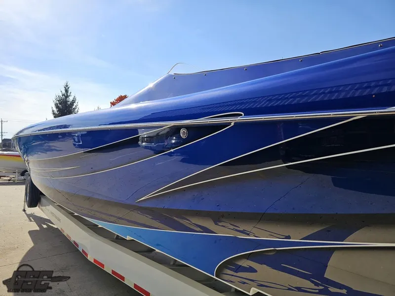 Slide: The Image of 2008 Outerlimits 46 Limited boat with sleek blue and silver design. - 30