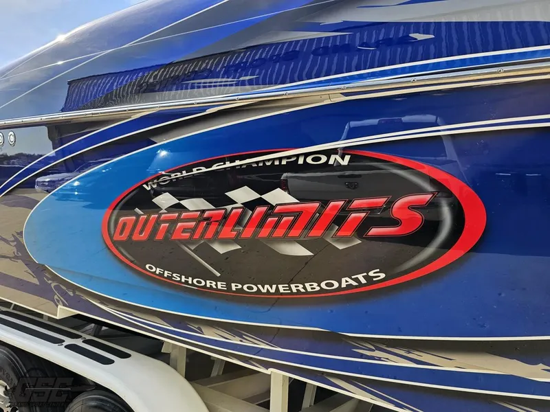 Slide: The Image of 2008 Outerlimits 46 Limited powerboat with bold logo and sleek blue design. - 35
