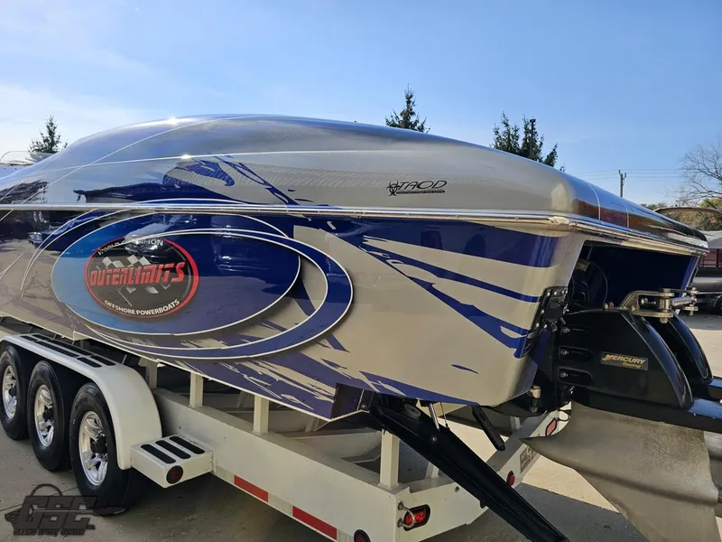 Slide: The Image of 2008 Outerlimits 46 Limited powerboat with custom blue and silver design on trailer. - 36