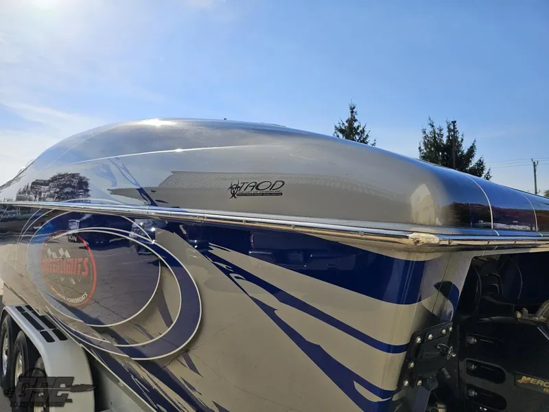 Slide: The Image of 2008 Outerlimits 46 Limited speedboat with sleek blue and silver design. - 37