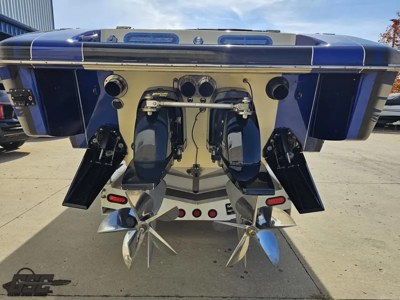 Slide: The Image of 2008 Outerlimits 46 Limited boat, rear view showing dual propellers and sleek design. - 41