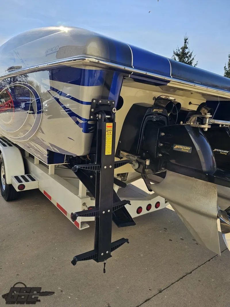 Slide: The Image of 2008 Outerlimits 46 Limited boat on trailer, showcasing sleek design and powerful engine. - 42