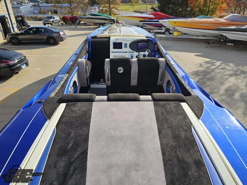 Slide: The Image of 2008 Outerlimits 46 Limited speedboat with sleek blue and gray interior design. - 47
