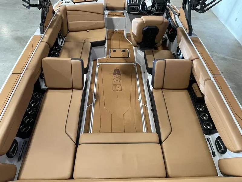 Slide: The Image of 2025 Axis A245 boat interior with tan leather seating and modern design. - 10