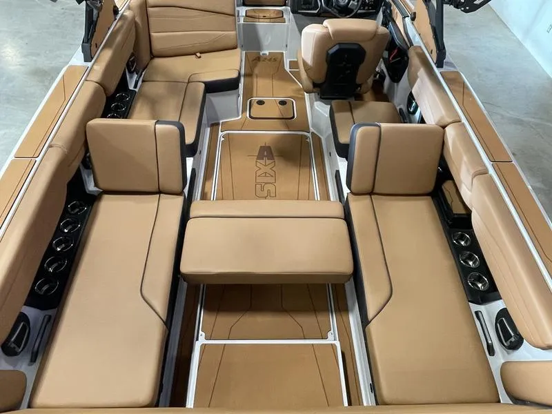 Slide: The Image of 2025 Axis A245 boat interior with tan leather seating and modern design. - 12