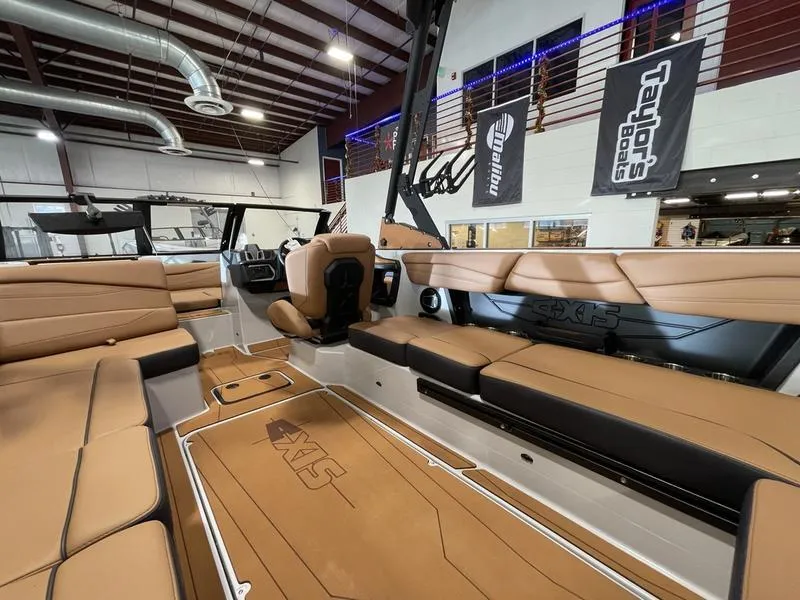 Slide: The Image of Luxurious interior of 2025 Axis A245 boat with tan leather seating. - 13