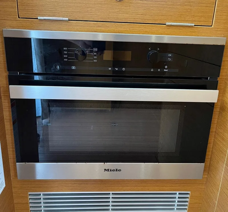 Slide: The Image of Miele oven in 2021 Beneteau Swift Trawler 41 kitchen. - 14