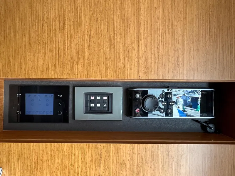 Slide: The Image of Control panel of 2021 Beneteau Swift Trawler 41 with navigation and system displays. - 20