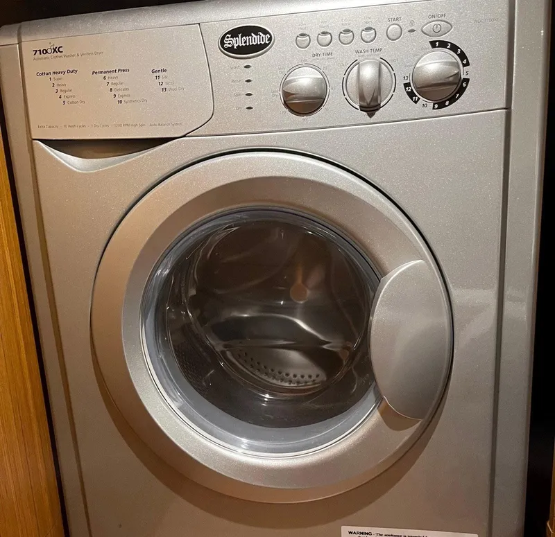 Slide: The Image of Splendide washing machine inside a 2021 Beneteau Swift Trawler 41. - 31