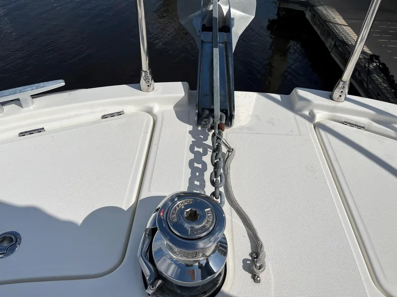 Slide: The Image of Anchor system on 2021 Beneteau Swift Trawler 41, featuring a polished winch and chain. - 32