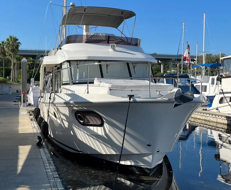 Slide: The Image of 2021 Beneteau Swift Trawler 41 docked at marina, sunny day. - 4