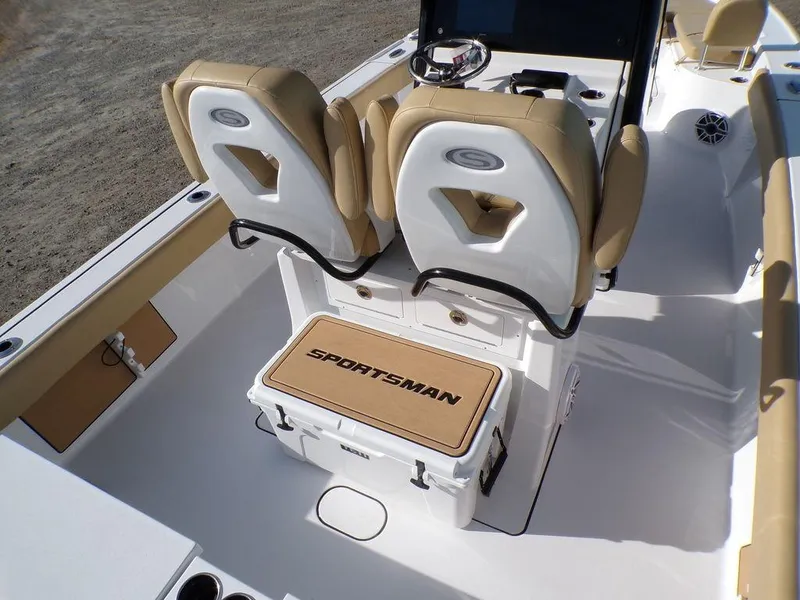 Slide: The Image of 2025 Sportsman Masters 267 boat interior with tan seating and branded cooler. - 15
