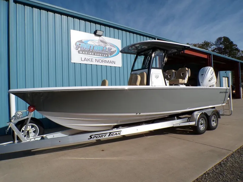 Slide: The Image of 2025 Sportsman Masters 267 boat on trailer at Lake Norman dealership. - 2