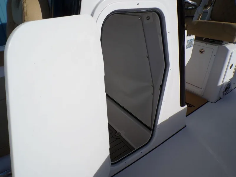Slide: The Image of Open hatch door on 2025 Sportsman Masters 267 boat interior. - 20