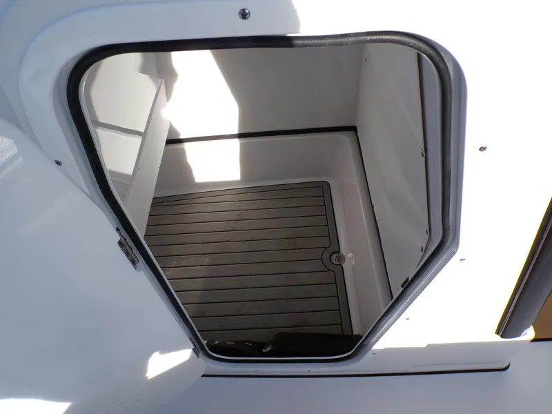Slide: The Image of Sportsman Masters 267 boat storage compartment, 2025 model, with non-slip flooring. - 21
