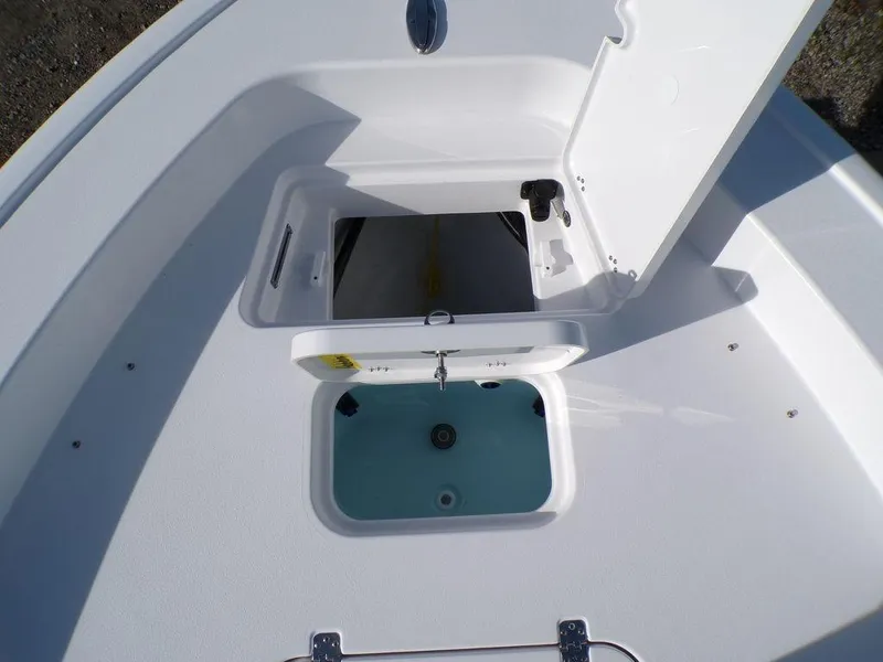 Slide: The Image of 2025 Sportsman Masters 267 boat storage compartment with open hatch. - 24