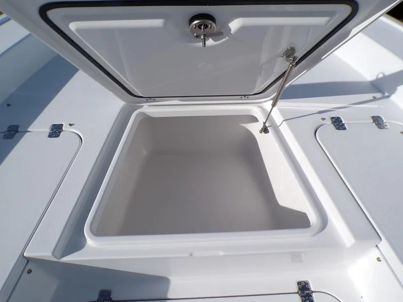 Slide: The Image of Open storage compartment on 2025 Sportsman Masters 267 boat. - 25
