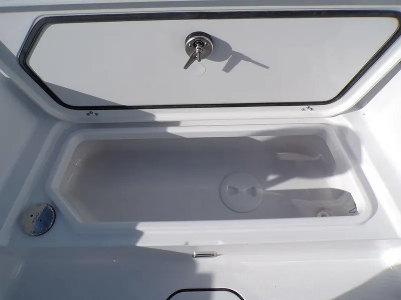 Slide: The Image of Open storage compartment on 2025 Sportsman Masters 267 boat. - 26