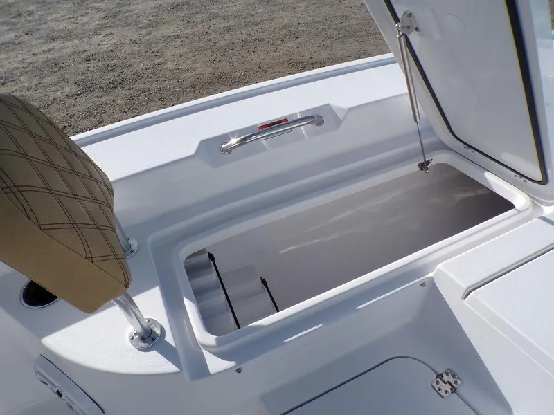 Slide: The Image of Open storage compartment on 2025 Sportsman Masters 267 boat. - 27