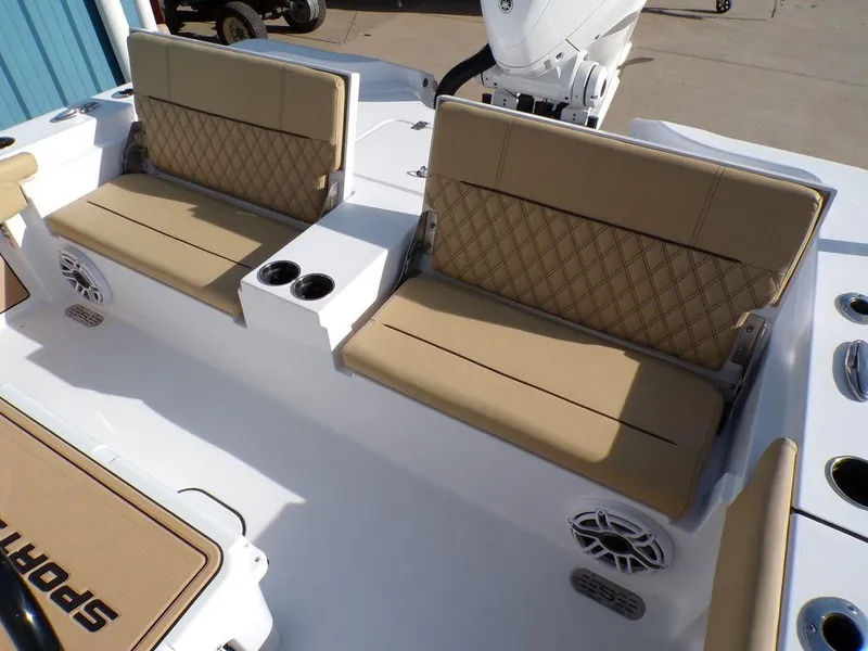 Slide: The Image of 2025 Sportsman Masters 267 boat seating with tan cushions and cup holders. - 33