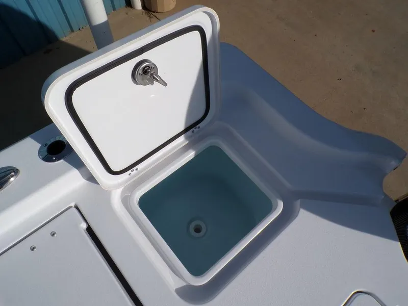 Slide: The Image of Open storage compartment on 2025 Sportsman Masters 267 boat. - 38