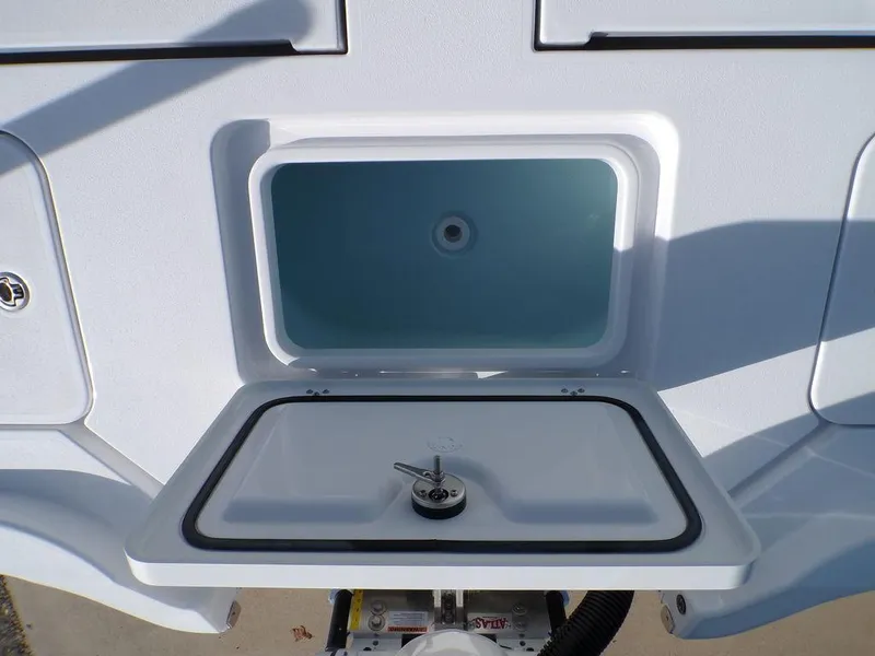 Slide: The Image of 2025 Sportsman Masters 267 boat livewell with open lid, showcasing interior design. - 40