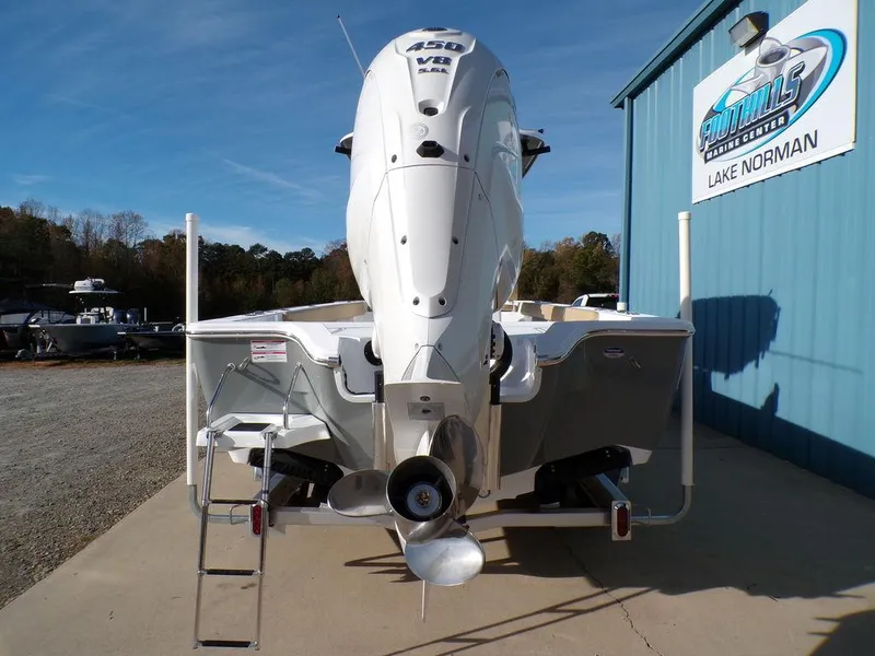 Slide: The Image of 2025 Sportsman Masters 267 boat with powerful outboard motor at Lake Norman dealership. - 6