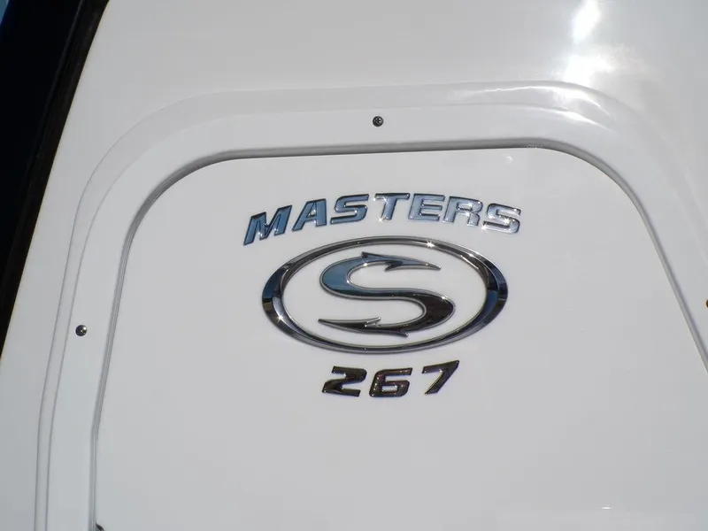 Slide: The Image of 2025 Sportsman Masters 267 boat logo on white surface. - 9