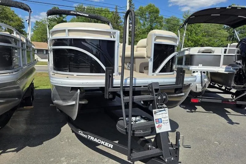 Slide: The Image of 2025 Sun Tracker SF 22 DLX pontoon boat on trailer, displayed outdoors. - 3