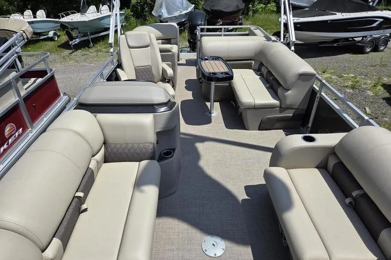 Slide: The Image of 2025 Sun Tracker PB 22 RF pontoon boat interior with beige seating and table. - 17