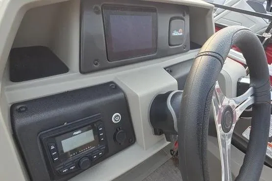 Slide: The Image of Dashboard of 2025 Sun Tracker FB 22 DLX boat with steering wheel and controls. - 10