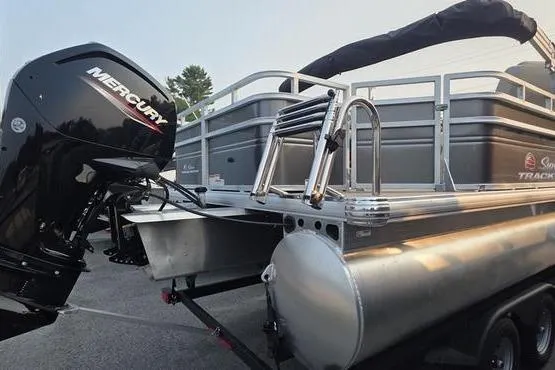 Slide: The Image of 2025 Sun Tracker FB 22 DLX pontoon boat with Mercury outboard motor. - 5