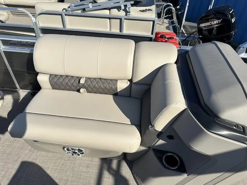 Slide: The Image of 2025 Sun Tracker FB 20 DLX boat interior with beige seating and modern design. - 10