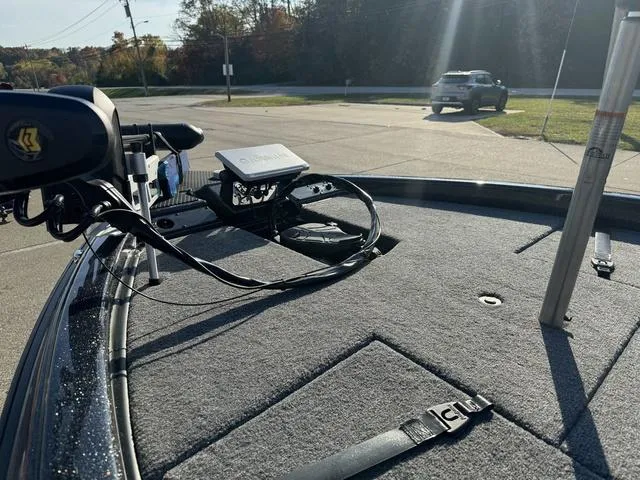 Slide: The Image of Phoenix 819 ZXL boat deck with mounted electronics, 2025 model, in a sunny parking lot. - 16