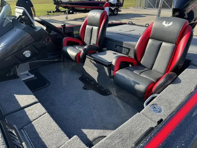 Slide: The Image of 2025 Phoenix 819 ZXL boat interior with red and black seats, spacious layout. - 18