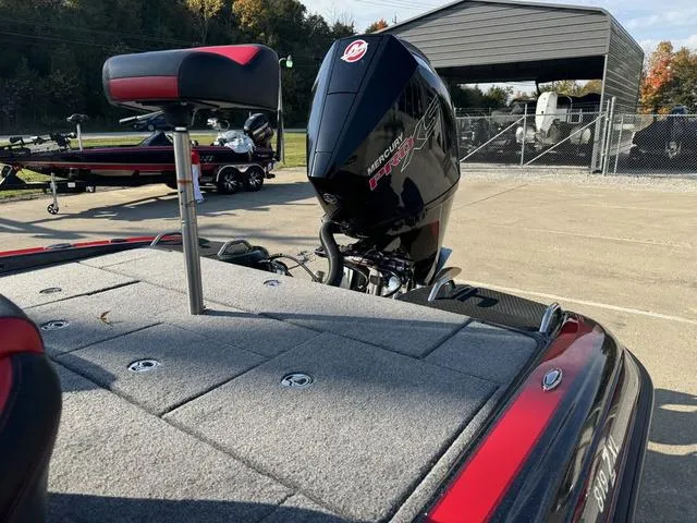 Slide: The Image of Phoenix 819 ZXL 2025 boat with Mercury Pro XS engine in a parking area. - 19