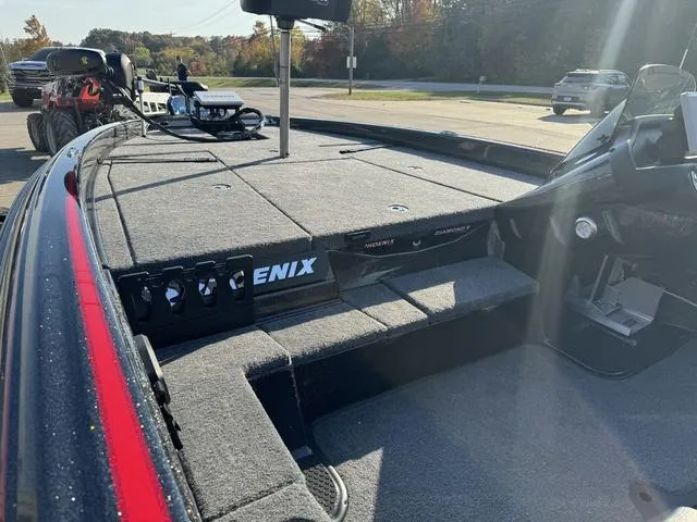 Slide: The Image of 2025 Phoenix 819 ZXL boat deck with control panel and seating area. - 20