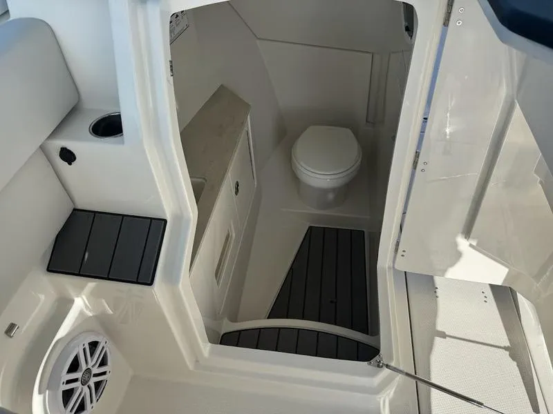 Slide: The Image of 2025 Sailfish 316 DC boat interior with compact bathroom and modern amenities. - 14