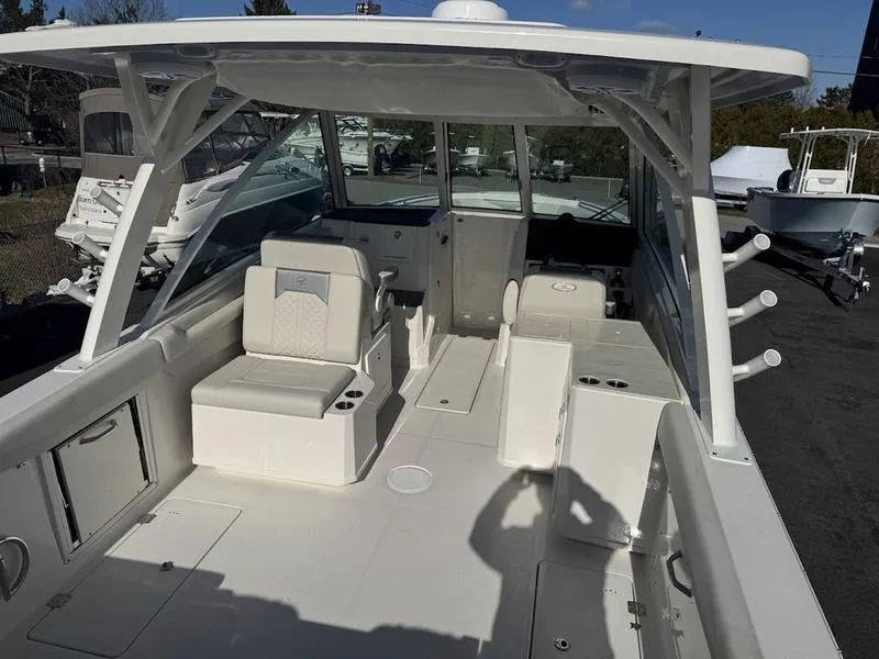 Slide: The Image of 2025 Sailfish 316 DC boat interior with seating and storage compartments. - 23