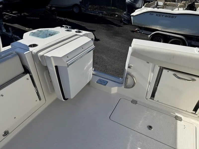 Slide: The Image of 2025 Sailfish 316 DC boat interior with seating and storage compartments. - 24