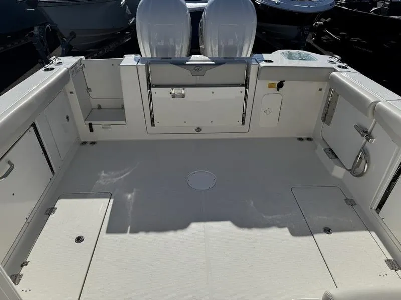 Slide: The Image of 2025 Sailfish 316 DC boat interior with spacious deck and seating. - 3