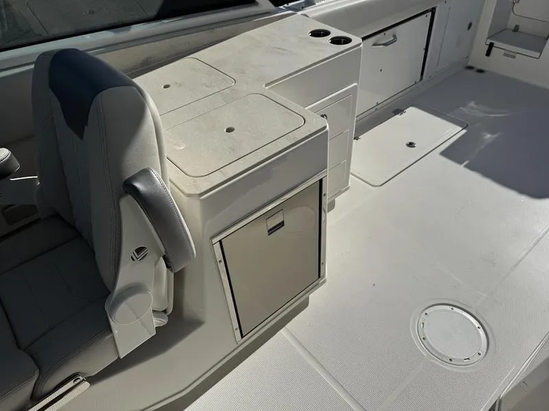 Slide: The Image of 2025 Sailfish 316 DC boat interior with seating and storage compartments. - 5