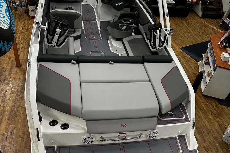 Slide: The Image of 2025 Cobalt CS23 Surf boat interior with sleek gray seating and modern design. - 11