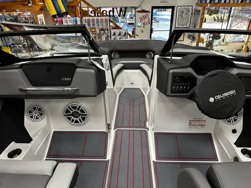 Slide: The Image of 2025 Cobalt CS23 Surf boat interior with modern dashboard and seating. - 8